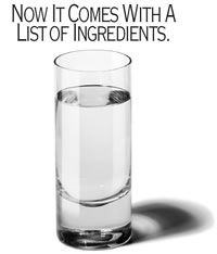 Example Image of one of the print ads.  Image of a glass of water with text above reading: Now It Comes With A List of Ingredients