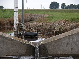 An instrumented water weir used to measure water runoff: Click here for photo caption.