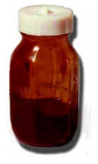 Picture of a small baby bottle containing a brown liquid.