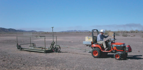 Photo of USGS scientist testing geophysical equipment.