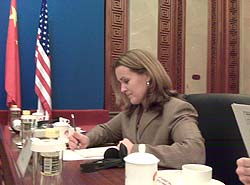 Photo of Lisa Lybbert at a table in the meeting area