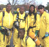 Job Training - A photo of six men in emergency training suits.