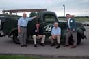 Under Secretary Dorr sits with members of Freeborn Mower Cooperative Services on their vintage pickup truck