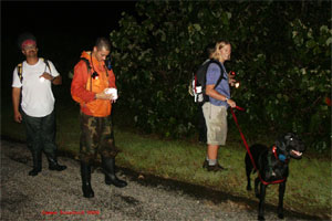 Brown treesnake detector dog team and response team members train to find snakes on Guam. (USGS photo)