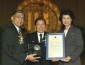 Secretary of Transporation Norman Y. Mineta (left), Secretary Chao (right), and Dr. John B. Tsu (center).