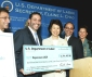 Secretary Chao (center), Rev. Luis Cortes, President of Esperanza USA second from left); as Dr. Larry Wilson, Chairman of the Orlando Regional Chamber of Commerce (far left); Rev. Danny Cortes, Sr. Vice President, Esperanza USA (second from right); and Ms. Miriam Rivera of South Florida Christian Social Services (far right).