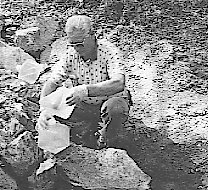 A scientist collects a water sample