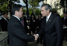 Secretary Gutierrez and President Enkhbayar shaking hands at Commerce building entrance. Click here for larger image.