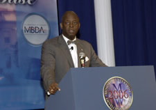 MBDA National Director Ronald Langston at podium.