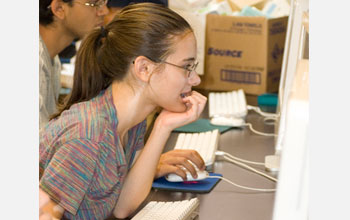 Photo of students doing bioinformatics research on computers