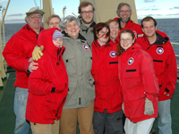 Coral team braves the wind for a group shot on deck.