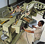 Man checking wood-working machine