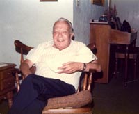 photo of Jud Dovell in his favorite chair at home, 1977