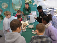 Chris Reich shares his knowledge and lots of samples with students as they learn more about coral reefs.