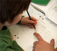 Photo of elementary school student doing math.