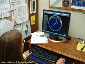 Lee Tibbitts tracking shorebirds on her computer at the Alaska Science Center in Anchorage, Alaska - photo by Daniel R. Ruthrauff, USGS