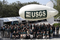 Mayor Rick Baker (front row center, in light shirt) and Open House participants posed under the USGS blimp