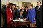 President George W. Bush signs H.R. 2622, the Fair and Accurate Credit Transactions Act of 2003, into law during a ceremony in the Roosevelt Room Thursday, December 4, 2003.  White House photo by Tina Hager