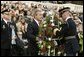 Honoring those who died in service to America, President George W. Bush lays a wreath at the Tomb of the Unknowns in Arlington Cemetery on Veterans Day Nov. 11, 2003. After the wreath was placed, "Taps" was played and a moment of silence was observed.  White House photo by Paul Morse