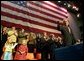 President George W. Bush waves to the crowd during a welcome rally at Southwest Missouri State University in Springfield, Mo., Friday, Oct. 18.  