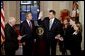 As President George W. Bush watches, Vice President Dick Cheney swears in Tom Ridge as the Secretary of the Department of Homeland Security in the Cross Hall Jan. 24, 2003. Secretary Ridge's wife, Michele, and children, Tom and Lesley, hold the Bible during the administering of the oath. "In October of 2001, when I established the office -- the White House Office of Homeland Security -- I knew immediately that Tom was the right man for the assignment. He's a decisive, clear-thinking executive who knows how to solve problems. He's a person of integrity and a person of good judgment," said the President in his remarks.  White House photo by Paul Morse