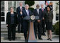 President George W. Bush addreses members of the media in the White House Rose Garden following his video teleconference Tuesday, Jan. 8, 2008, with Iraq Provincial Reconstruction Team Leaders and Brigade Combat Commanders. President Bush is joined from left by Kristin Hagerstrom, John Smith, Dr. John Jones, U.S. Secretary Condoleezza Rice and Deputy Secretary of Defense Gordon England. The PRT's mission is to help strengthen moderate Iraqi leaders at the local, municipal and provincial level by providing assistance to help create jobs, deliver basic services and build up local economies. White House photo by Chris Greenberg