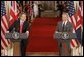 President George W. Bush and British Prime Minister Tony Blair hold a joint press conference in the East Room Tuesday, June 7, 2005. "Prime Minister Blair and I share a common vision of a world that is free, prosperous, and at peace," said President Bush. "When men and women are free to choose their own governments, to speak their minds, and to pursue a good life for their families, they build a strong, prosperous and just society."  White House photo by Paul Morse