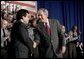 President George W. Bush thanks Attorney General Alberto Gonzales after speaking about the Patriot Act at the Ohio State Highway Patrol Academy in Columbus, Ohio, Thursday, June 9, 2005.  White House photo by Eric Draper