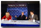 President George W. Bush participates in a roundtable discussion on corporate responsibility at America II Electronics in St. Petersburg, Florida, Friday, March 8, 2002. Also pictured at right, CEO of America II Electronics Michael Galinski, and employee Sarah Wood. White House photo by Eric Draper.