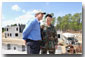 President George W. Bush and Brigadier General Richard Mills, Deputy Commander of U.S. Special Forces, view a tactical demonstration from the roof of a building at Fort Bragg, North Carolina, Friday, March 15, 2002. White House photo by Eric Draper.