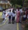 School children in the blind school, Tangalle walk along the tactile pathway