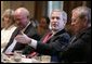 President Bush gestures as he speaks to news reporters, Wednesday, July 13, 2005, prior to the start of a cabinet meeting at the White House. From left to right are cabinet members Secretary of Interior Gale Norton, Secretary of Energy Samuel W. Bodman and Secretary of Defense Donald Rumsfeld.  White House photo by Eric Draper