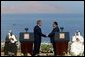 President George W. Bush and President Hosni Mubarak of Egypt after delivering statements on the progress of the Red Sea Summit in Sharm El Sheikh, Egypt June 3, 2003. On the far left sits Prince Abdullah Bin Abd Al Aziz of Saudi Arabia and on the far right sits King Hamad Bin Issa Al Khalifa of Bahrain.  White House photo by Paul Morse