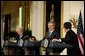 President George W. Bush, European Council President and Greek Prime Minister Konstandinos Simitis, left, and European Commission President Romano Prodi conduct a joint press conference in the East Room Wednesday, June 25, 2003. "We meet at an important moment, a time when the EU is taking in new members and writing a new constitution. And a time when both Europe and America are facing new challenges in the world's peace and prosperity," President Bush said.   White House photo by Susan Sterner