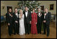 President George W. Bush and Mrs. Laura Bush stand with the Kennedy Center honorees in the Blue Room of the White House during a reception Sunday, Dec. 3, 2006. From left, they are: singer and songwriter William "Smokey" Robinson; musical theater composer Andrew Lloyd Webber; country singer Dolly Parton; film director Steven Spielberg; and conductor Zubin Mehta.  White House photo by Eric Draper