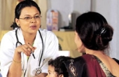 Photo of a trained counselor providing family planning advice to women at a Sun Quality Health clinic in Nepal.