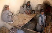Photo of Afghan women working in a USAID-funded bakery