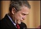 President George W. Bush bows his head in prayer during the National Prayer Breakfast in Washington, D.C., Thursday, Feb. 3, 2005.  White House photo by Paul Morse