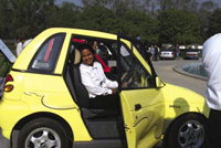 The REVA electric car gets a test drive in New Delhi.
