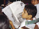 Bolivian boy practices reading.