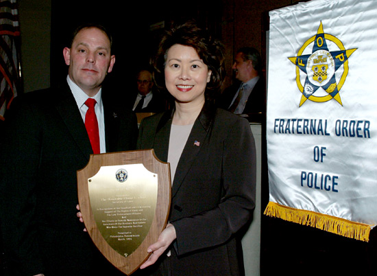 Fraternal Order of Police (F.O.P.) National President Chuck Canterbury presents the F.O.P.'s President’s Award to Secretary of Labor Elaine L. Chao