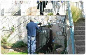 Israeli teacher showing the rain harvesting system he built in a school in Jerusalem.