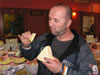 A potential buyer samples locally-produced cheese