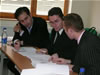 Arben Xheladini and Alban Sutaj prepare their case with assistance from DLA-Piper attorney Mr. John Vukelj