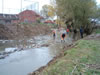 Workers remove trash from the river bed in Skenderaj/Srbica