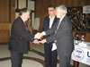 Dr. Michael Farbman joins UP Rector Enver Hasani in presenting certificates to University staff and lecturers