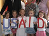 Children of the Gezimi Yne kindergarten in Mitrovice/a, show their appreciation to USAID