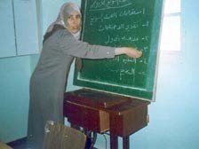 Photo: Abeer Rahhal uses skills learned in her training to teach other women about health.
