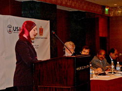 Iman Abdel Kahlek, an MBA graduate, addresses participants at a graduation ceremony. Her MBA was sponsored through USAID.