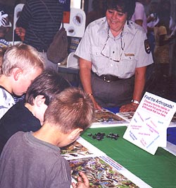 Jean teaches kids how to find the arthropods.